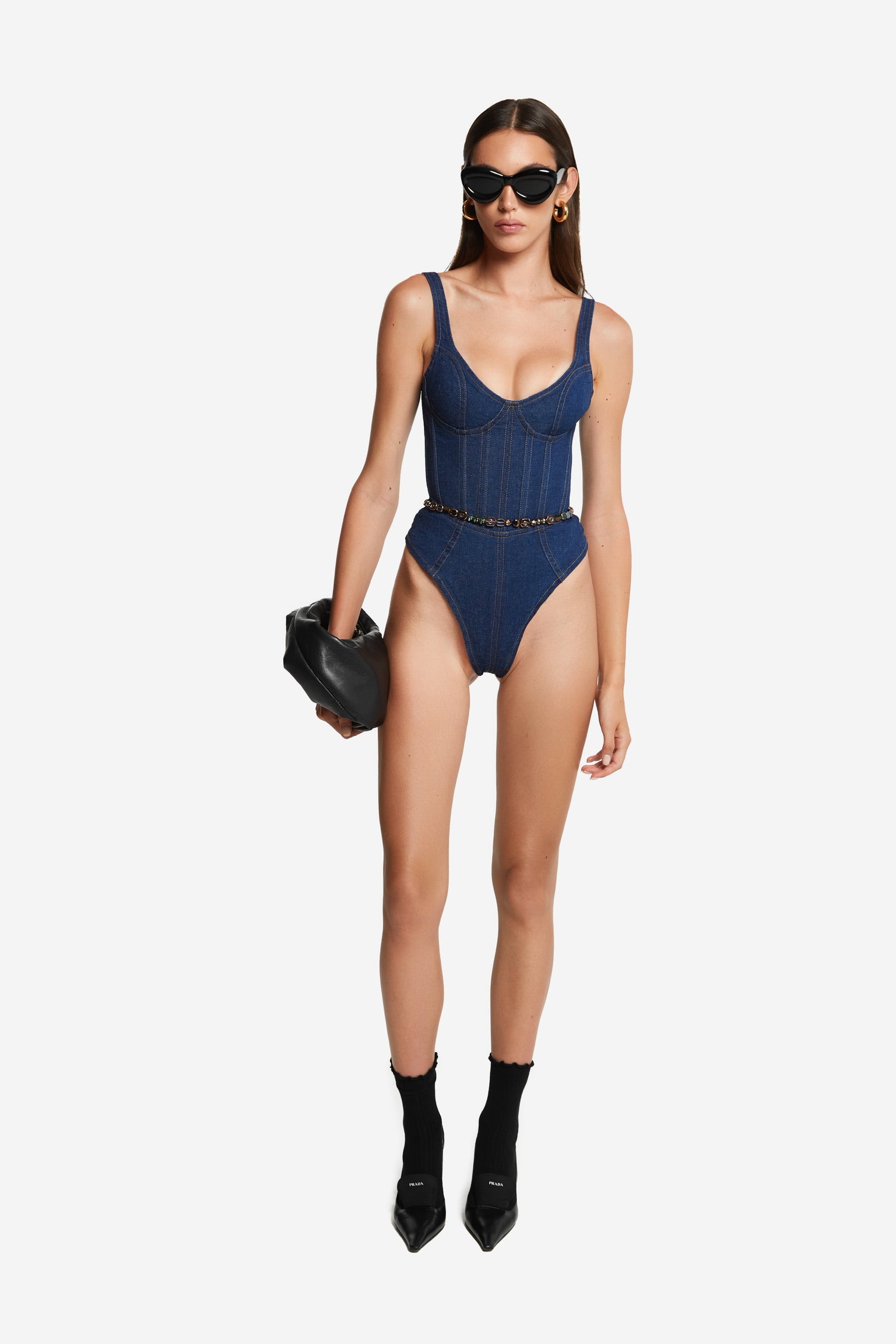Tall brown haired girl in denim bodysuit